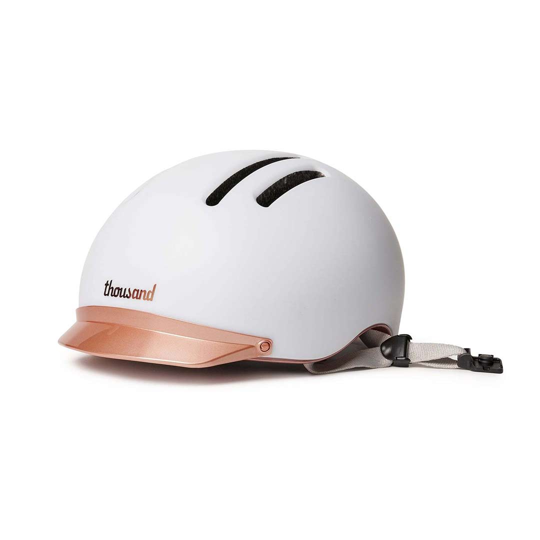 White Chapter MIPS Helmet by Thousand with rose gold visor on white background. @color_supermoon white